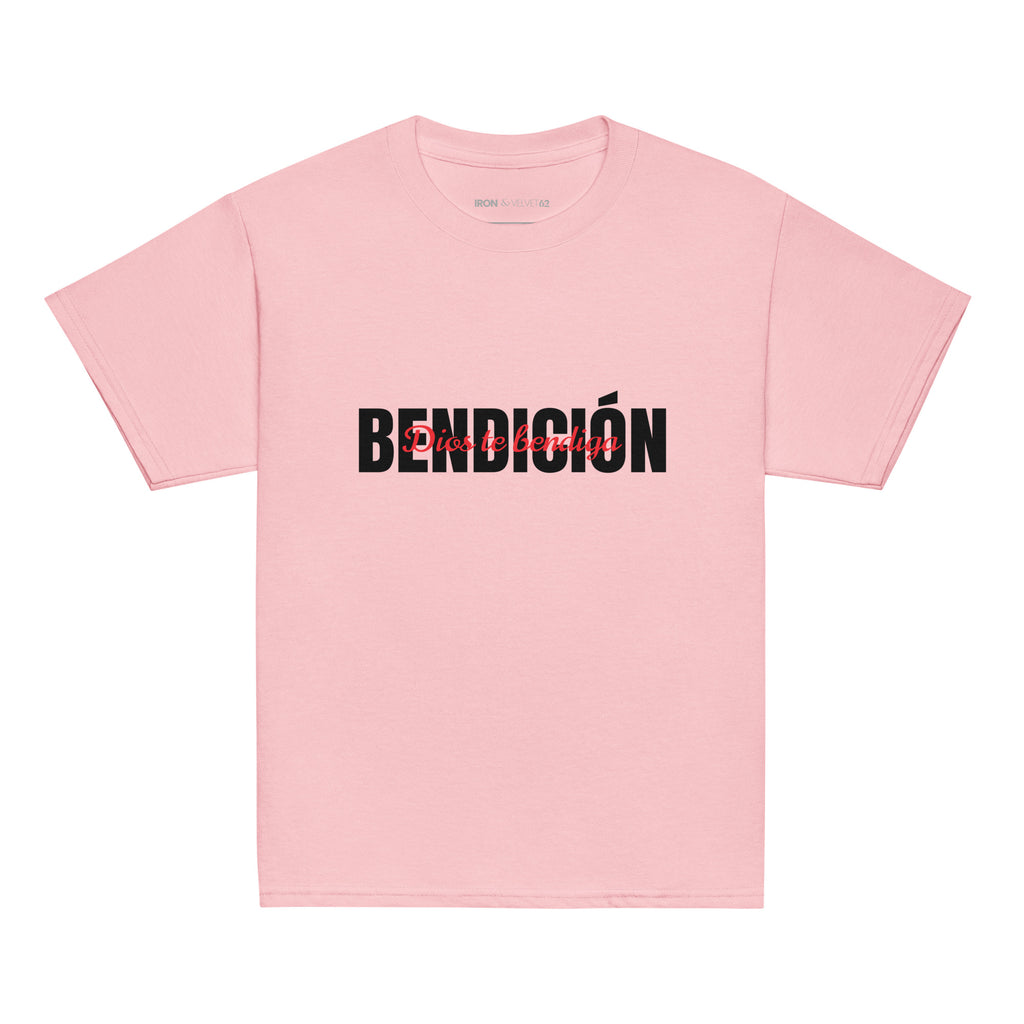 pink bendicion kids tshirt displayed on a white background with bold black bendición text across the chest and smaller red script layered over the center of the design designed by iron and velvet 62