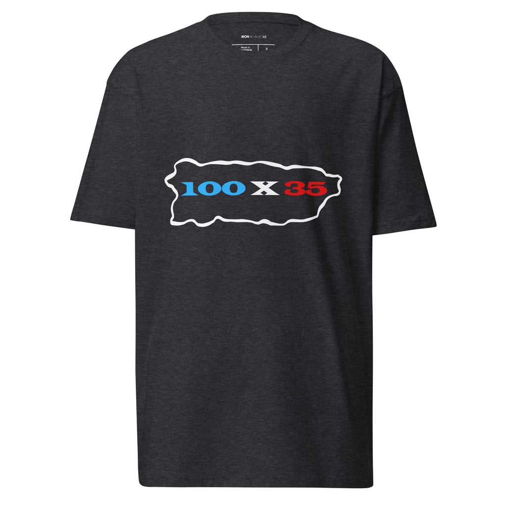 charcoal mens tshirt displayed on a white background featuring 100 by 35 text in red white and blue inside a puerto rico island outline minimal boricua statement design by iron and velvet 62