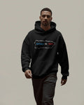 person wearing a black unisex hoodie displayed on a neutral background featuring 100 by 35 text in red white and blue inside a puerto rico island outline minimal boricua statement design by iron and velvet 62