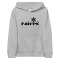 gray kids hoodie displayed on a white background with bold black raíces text across the chest and taíno sun detail, puerto rican cultural design by iron and velvet 62